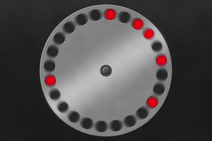 Diagrama circular mostra câmaras numeradas de um revólver, com várias posições marcadas em vermelho.