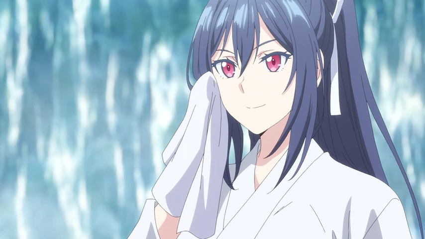 Yukine Mizumori aparece em close, diante de uma cachoeira.
